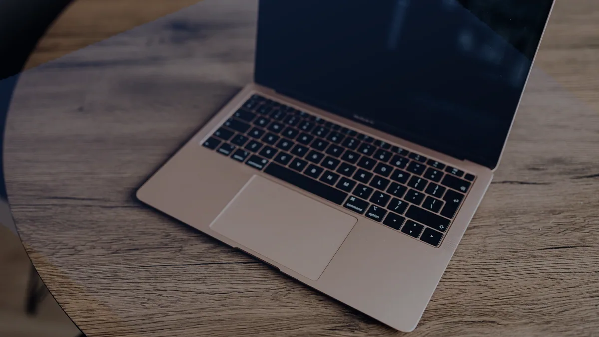 A Mac on a desk.